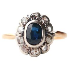 Late XIX-early XX cent. German Halo Ring with natural Blue-Green Sapphire and 10 old rose-cut Diamonds. Hallmarked 18K (tested) . Crown in Silver measures 12 mm x 10 mm x 5 mm deep. All stones are set in extra secure bezel-type settings that firmly hold the stones and provide better protection to girdles. Such settings construction is much less vulnerable to wear, damage, or deformations, great for every day (still careful) wear. Dark Blue with a tint of Green natural Sapphire, old oval cut with Old Rings, Blue Green Sapphires, Girdles, Green Sapphire, Old Jewelry, Art Deco Diamond, Halo Ring, Natural Sapphire, Halo Rings