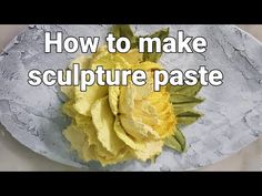 a white plate topped with yellow flowers and the words how to make sculpture paste