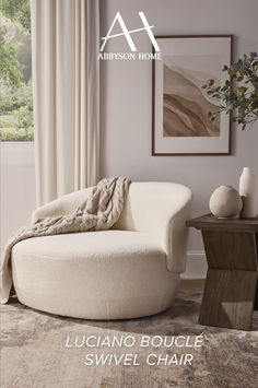 a living room with a round chair and rug on the floor, in front of a window