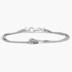 Finish off your ensemble with this sophisticated sterling silver bracelet, featuring three wheat chain strands and a knotted design. Elegant Sterling Silver Braided Bracelets With Silver Chain, Adjustable White Gold Braided Sterling Silver Bracelet, Elegant Sterling Silver Wheat Chain Bracelet, Engraved Link Sterling Silver Bracelet Adjustable, Elegant Silver Braided Bracelet With Lobster Clasp, Classic Adjustable Sterling Silver Bracelet, Tarnish Resistant, Top Gifts For Women, Adjustable Sterling Silver Braided Bracelet, Nickel-free, Nickel-free Sterling Silver Chain Link Bracelet