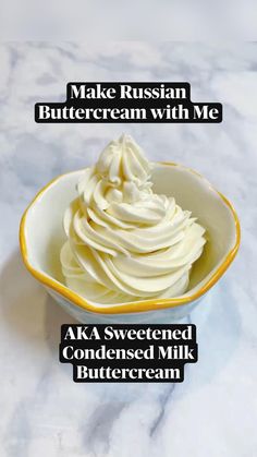 a bowl filled with whipped cream sitting on top of a counter