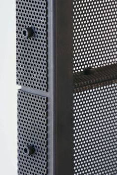 the side view of a metal cabinet with perfored holes on it's sides