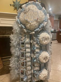 a large blue and white wreath with the word bb on it