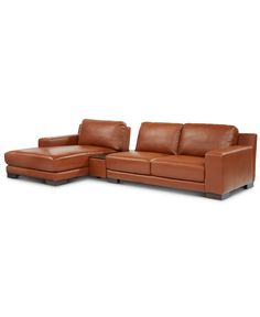 a brown leather couch and ottoman on a white background