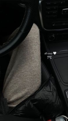 the interior of a car with an air vent and steering wheel cover on it's center console