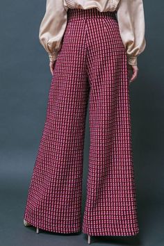 Tweed Wide Leg Pearl Button Plaid Pants Brand: Flying Tomato Style: IP8039 Fabric: 100% Polyester Details: A tweed pant featuring high waist, front button zipper closure, two front faux pockets and wide leg Chic Plaid Wide Leg Pants, Plaid Tweed Bottoms For Fall, Elegant Plaid Wide-leg Pants, Fall Houndstooth Wide Leg Pants, Fall Tweed Trousers, Chic Wide Leg Bottoms With Houndstooth Pattern, Wide-leg Plaid Pants With Houndstooth Pattern, Chic Plaid Houndstooth Pants, Plaid High-waisted Wide Leg Pants For Fall