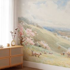 a room with a painting on the wall next to a dresser and sideboard in front of a window