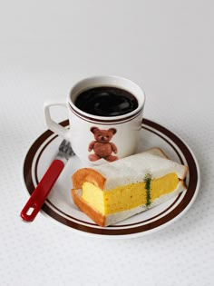 a cup of coffee and some food on a plate