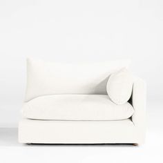 a white couch with pillows on it