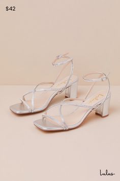 From cute date nights to wedding invites, step out with confidence in the Lulus Makenna Silver Rhinestone Strappy Ankle Strap Low Heel Sandals! These wear-with-anything sandals have a smooth faux leather construction that shapes a trendy square footbed with a slender toe strap and crisscrossing vamp straps. An adjustable ankle strap sprouts from the sides and secures with a shiny silver buckle, all atop a cute block heel. Glittery, dainty rhinestone details throughout lend an extra fabulous fini Sparkling Heels For Summer Wedding, Summer Wedding Sparkling Heels, Sparkling Summer Wedding Heels, Sparkling Wedding Shoes For Summer Evening, Sparkling Evening Wedding Shoes For Summer, Sparkling Summer Wedding Shoes For Prom, Sparkling Summer Evening Wedding Shoes, Silver Block Heel Wedding Shoes For Spring, Sparkling Sandals For Spring Wedding