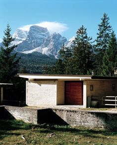 a house with a mountain in the background