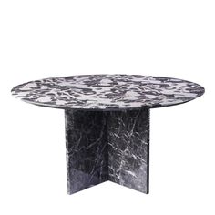 a round marble table with black and white designs on it, against a white background