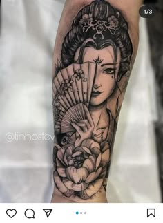 a woman with a fan tattoo on her arm