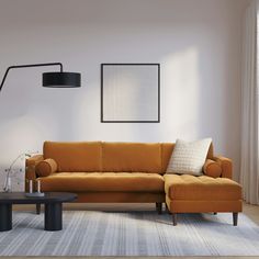 a living room with a couch, table and lamp