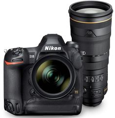 the nikon d700 is next to a large lens