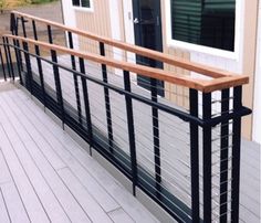 the balcony railing is made of metal and wood