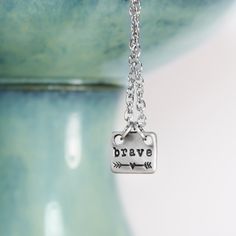 Wear this tiny little brave necklace to remind yourself to be brave....and never give up. How can we be more brave? I find it's best to take stock of where I'm at right now, and be willing to fail.7 12mm x 10mm Lead free pewter Hand stamped Choose your chain length Brave Necklace, Jewelry Care Card, Anchor Necklace, Human Hand, Hand Stamped Jewelry, Be Brave, Stamped Jewelry, Polish Jewelry, Free Jewelry