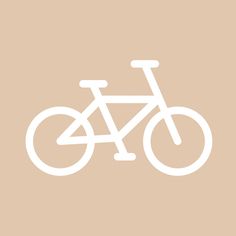 a white bicycle on a beige background with the word bike written in it's center