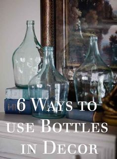 several glass bottles sitting on top of a dresser