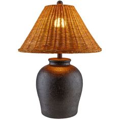 a lamp that is sitting on top of a wooden base with a wicker shade