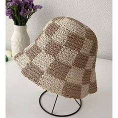 Slay in style with the Checkered Chic Bucket Hat! This trendy straw hat is perfect for any outfit and features an adjustable strap for a perfect fit. Whether you want to rock a cute, chic look or add a touch of playfulness, this bucket hat is a must-have accessory. Trendy Woven Sun Hat For Vacation, Trendy Adjustable Bucket Hat For Beach Season, Trendy Woven Hats For Vacation, Casual Adjustable Crochet Hat With Woven Details, Casual Adjustable Woven Crochet Hat, Trendy Woven Vacation Hat, Trendy Bucket Hat For The Beach, Trendy Short Brim Bucket Hat For Beach, Trendy Beach Bucket Hat One Size Fits Most