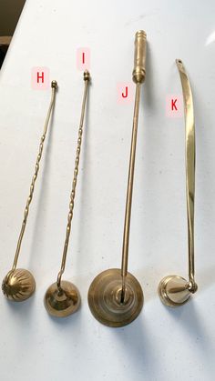 four different types of handles on a white surface