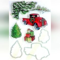 a red truck with presents in the back and trees on top, surrounded by cut outs