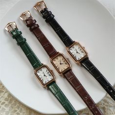 Welcome to AffordLuxe Watches! We're delighted to have you here in our store 🤩 Discover the perfect blend of elegance and style with this stunning rectangular women's wristwatch. The design features a unique rectangular face adorned with classic Roman numerals, providing a timeless and chic look. Complemented by a luxurious leather strap, this watch is available in three rich colors: deep green, warm brown, and classic black. We highly recommend you this watch for its versatility and comfort. P Vintage Rectangle Watch, Elegant Women Watches, Dainty Leather Watch, Classic Bracelets Women, Brown Watch Aesthetic, Brown Leather Watch Women's, Vintage Watches For Women, Retro Watches Women, Vintage Wrist Watch Women