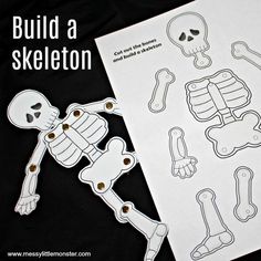 a paper skeleton cut out with the words build a skeleton on it's side