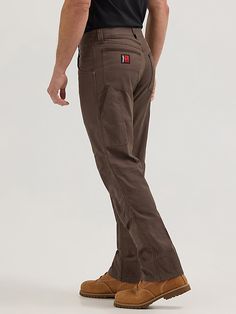 WORKWEAR WARDROBE STAPLE A style that works as hard as you do, our Wrangler® RIGGS WORKWEAR® Utility pants are designed to stand up to any job that comes their way. The durable yet lightweight pants feature reinforced front panels and a cotton blend construction with the right amount of stretch to keep you moving comfortably. Function-first pockets, including a large utility side pocket and reinforced, Cordura-lined back pockets, provide plenty of storage options for small tools and other on-the Rugged Workwear Men, Fitted Brown Work Pants With Pockets, Brown Work Pants With Side Pockets, Brown Work Pants With Hip Pockets, Brown Straight Leg Work Pants, Brown Utility Work Pants With Belt Loops, Brown Full Length Work Pants With Belt Loops, Construction Pants, Workwear Wardrobe