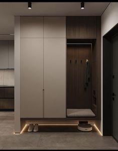 an empty walk in closet with lights on the floor