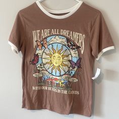 Size S. Super Soft And Cute Hippy Light Brown Ringer T-Shirt! New With Tags Size Small. Features Lots Of Flora And Fauna Including The Sky, Clouds, The Sun, Fungi And Mushrooms, Butterflies, Flowers, And Grass. Features A Logo “We Are All Dreamers With Our Heads In The Clouds.” So Hippie Whimsigothic Witchy Y2k Astrology Vibes. Eclectic Townhouse, Heads In The Clouds, Hippie Clothing, Butterflies Flowers, Hippie Shirt, Black Crow, Ringer Tee, In The Clouds, Hippie Outfits