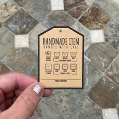 someone holding up a handmade item with instructions to make it look like they are washing their hands