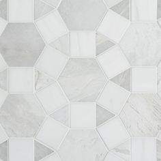 a white and grey tile pattern with small squares