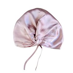 Made from 100% Pure Mulberry grade A Silk, these elegant front twisted silk hair bonnets are not only aesthetically pleasing but also a great hair care product that helps maintain and revive your hair keeping it soft and hydrated. This is our adjustable version with silk adjustable straps that can be adjusted to fit different head sizes.   These caps have been designed to provide a number of hair benefits, few of which include but not limited to :Protects your hair styles and up dos , prevents breakages and split ends by reducing friction ,helps in growing long hair, retains moisture in hair. The material used is 100% double layered silk. In order to maintain the quality of the fabric we advise that you only hand wash this product in cold water and air dry, running a warm steam will remove Silk Hair Bonnets, Silky Shiny Hair, Hair Bonnets, Silk Bonnet, Hair Turban, Frizz Free Hair, Grow Long Hair, Hair Bonnet, Pearl Pink