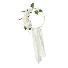 a white flower headband with green leaves and flowers on the side, hanging from a wire