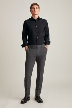 We don’t expect shopping for a dress shirt to be a challenge – not for your first real office job and not a few years down the road when you’re wondering, “What do I wear to this wedding?” After all, men’s dress shirts appear straightforward. We don’t have to contend with the multiple silhouettes, patterns, and trends shaping women’s offerings. Good Dress, Man Office, Standing Poses, Stretch Dress, Formal Shirts, Comfortable Dress, Athletic Wear, Mens Suits, Dress Shirt