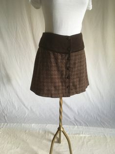 "vintage 1990s mini skirt Wrapper, made in USA acrylic, wool(upper waist section), cotton  brown w/light brown crosshatch weave unlined corduroy buttons up front corduroy piping trim good vintage condition, light wear labeled 11/12-see below measures, lying flat, waist-14 1/2\" and goes to 15\" w/a tug hip-21\" length-16\"" Pop Style, Corduroy Skirt, Vintage 90s, Light Brown, Mini Skirt, Made In Usa, Womens Skirt, Button Up, Bathing Beauties