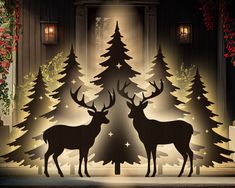 two deer standing next to each other in front of a christmas tree with lights on it