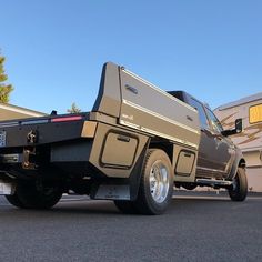 a truck is parked in front of a trailer