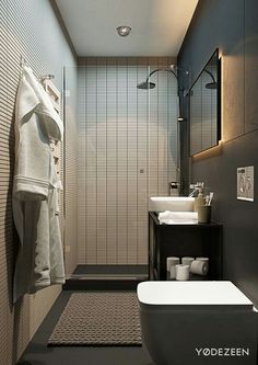 a bathroom with a toilet, sink and bathtub next to a wall mounted shower head