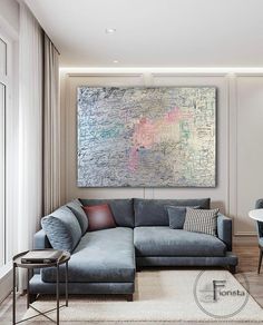 a living room filled with furniture and a large painting on the wall above it's couch