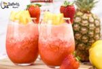 three glasses filled with fruit and garnish on top of a cutting board