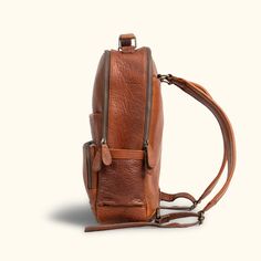 We aimed for the spirit of Roosevelt, of action and purpose, into our new commuter backpack. Crafted from the untamed strength and character of rich full grains of buffalo leather which epitomizes durability and rugged luxurious style. Within its soft but sturdy construction, this backpack unveils a multitude of compartments meticulously designed to accommodate your every need. From safeguarding your laptop (up to 15") with a cushioned section, to providing a secure space for your iPad, notebook Travel Leather Backpack With Vegetable Tanned Leather, Travel Leather Backpack With Vegetable-tanned Leather, Daily Backpack With Leather Backing In Vegetable Tanned Leather, Textured Leather Travel Backpack, Everyday Textured Leather Standard Backpack, Everyday Textured Leather Backpack, Textured Leather Backpack For Everyday Use, Travel Backpack With Vegetable Tanned Leather And Leather Lining, Vegetable Tanned Leather Backpack With Leather Backing