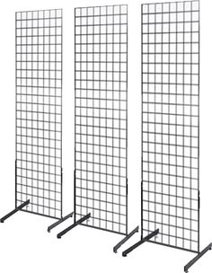 three black metal partitions with grid design on each side and one in the middle