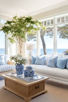 a living room filled with furniture and a tree in the middle of it's center