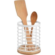 two wooden utensils in a white container