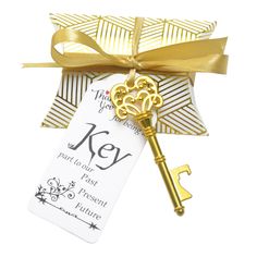 a golden key tied to a gift card