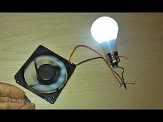 a light bulb is plugged into a fan with wires attached to it and an electrical wire connected to the fan