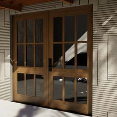 two wooden doors are open on the side of a building